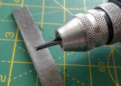 A photo of some initial filing of the plastic part